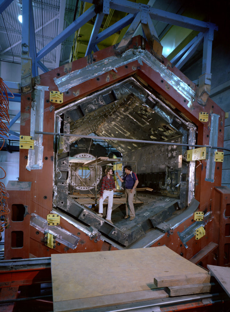 The Time Projection Chamber, shown with inventor David Nygren (left), was designated for use at the positron-electron colliding beam ring at Stanford.